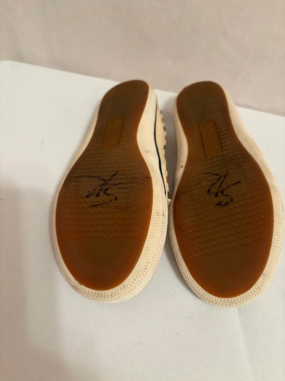 Sperry Lounge Away sneakers in a natural, red, and blue stripes